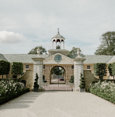 The clock tower and gates at Hotham Hall